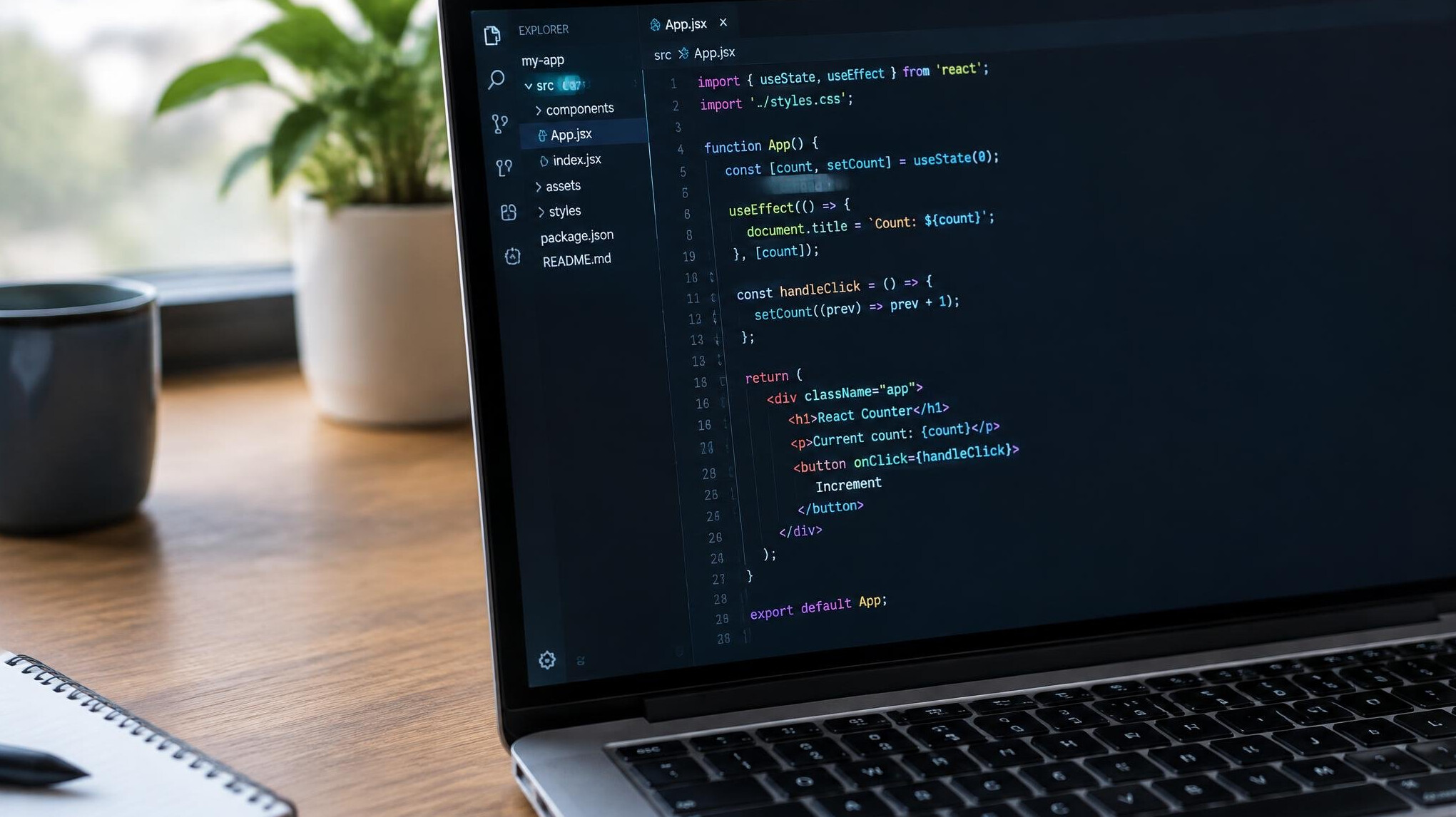Laptop screen showing colorful programming code