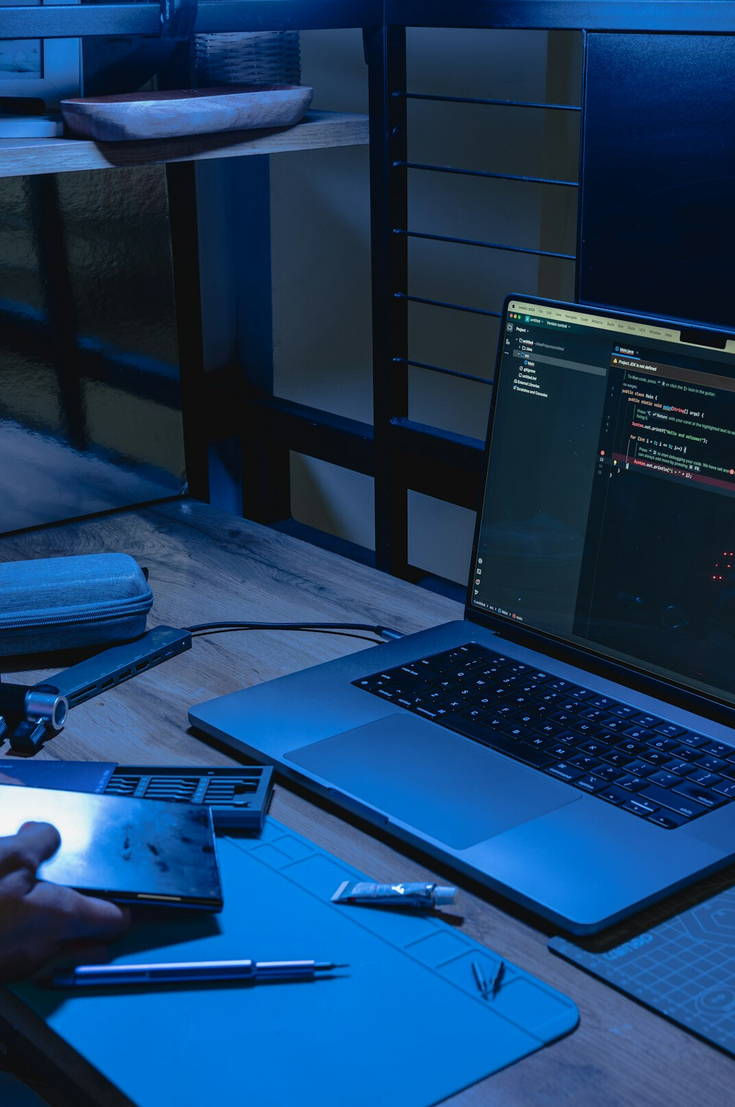 person coding at home desk