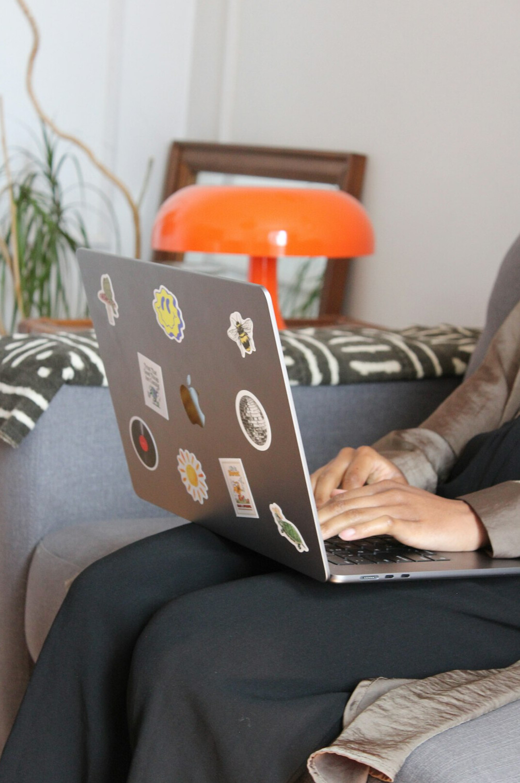 person coding on laptop at home